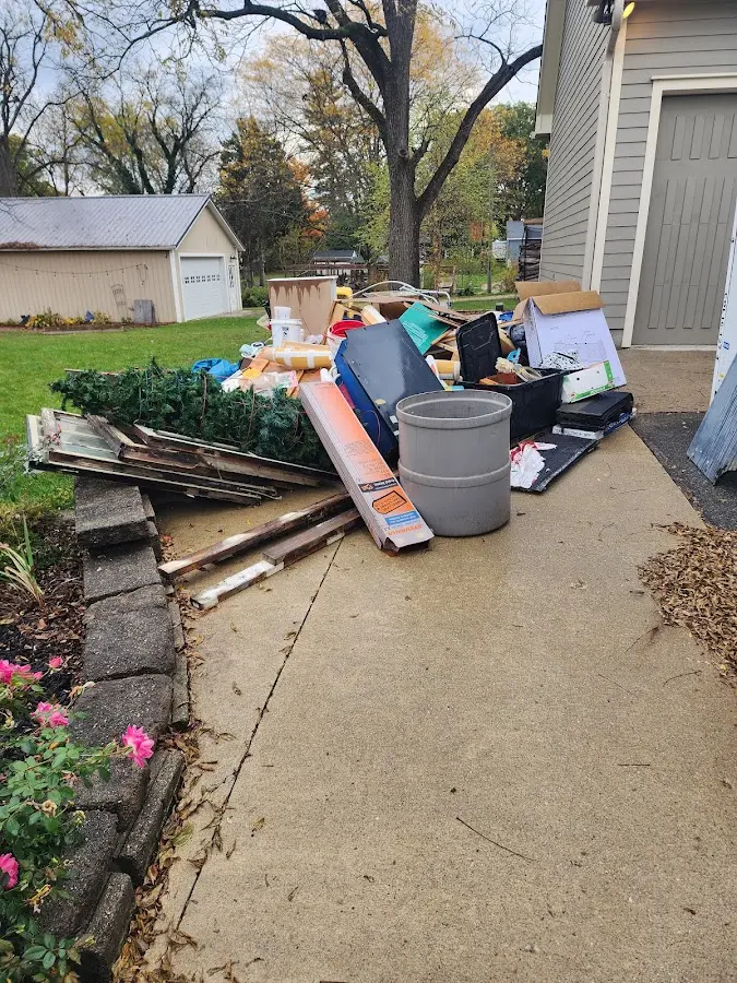 Dumpster being loaded with debris for Estate Cleanout Dumpster Rental in Portville